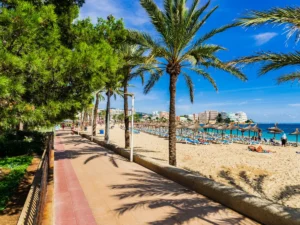 Walking along the beach in Magaluf